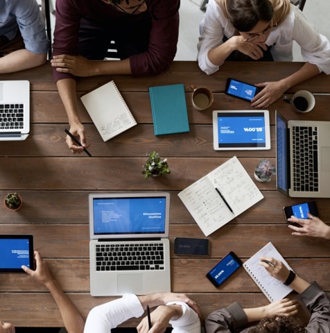 desktop birds eye view image of people collaborating around a table