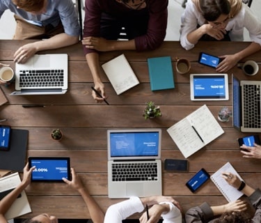 mobile birds eye view image of people collaborating around a table