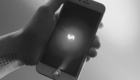 desktop phone being held by a hand