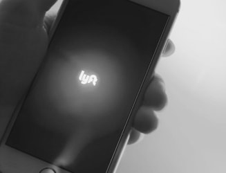 mobile phone being held by a hand